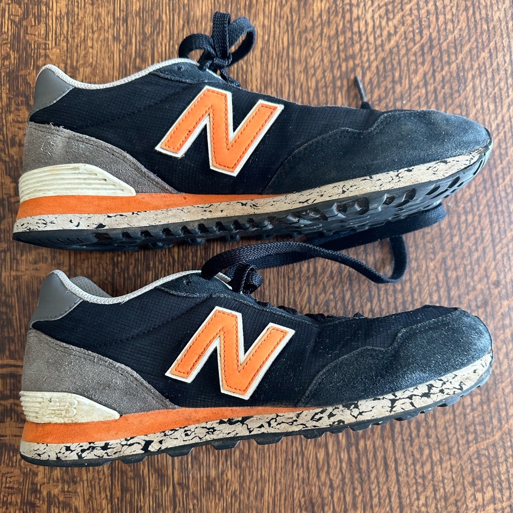Black and orange New Balance 515 trainers